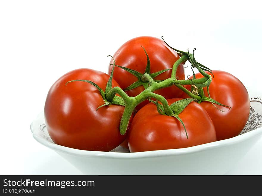 A stack of tomatoes  on white background