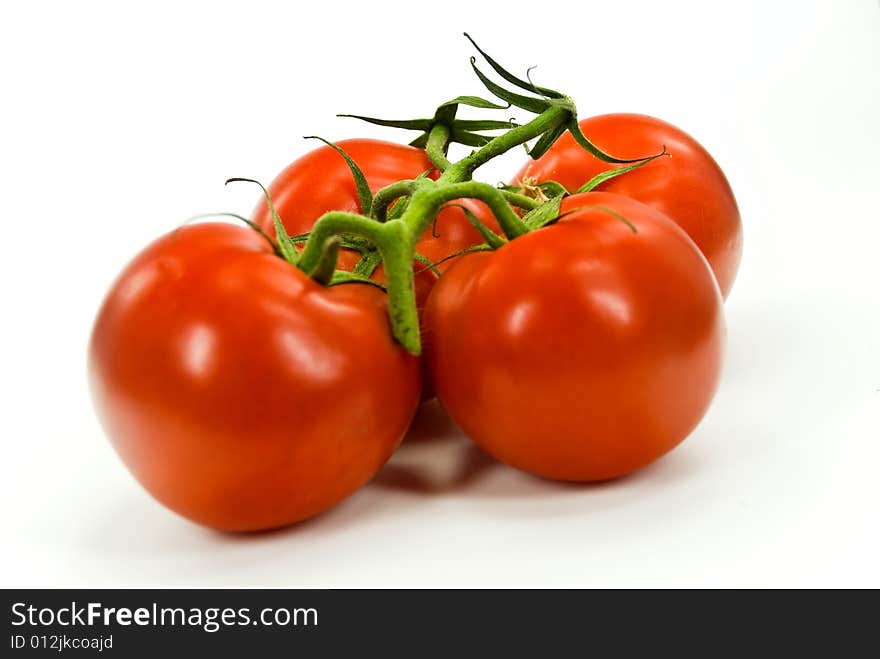 A stack of tomatoes  on white background