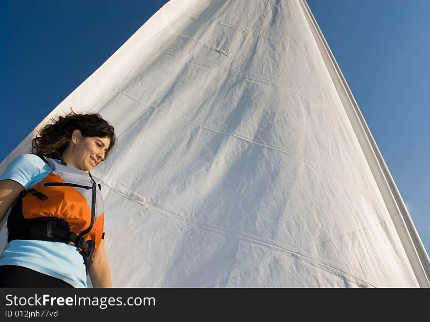 Woman Standing Against Sail on Boat - Horizontal