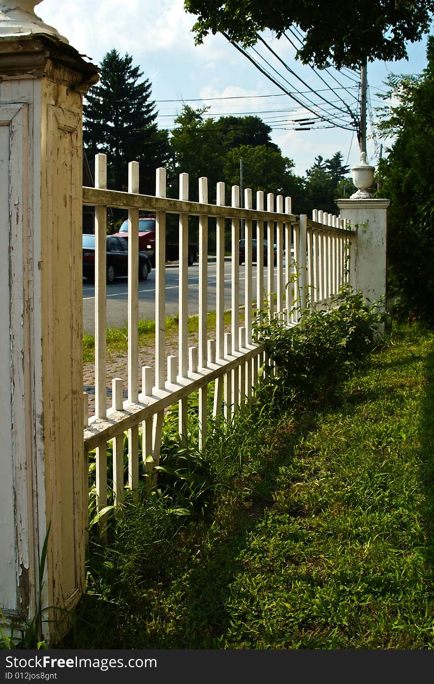 Classic new england picket fence stretching off into the distance. Classic new england picket fence stretching off into the distance