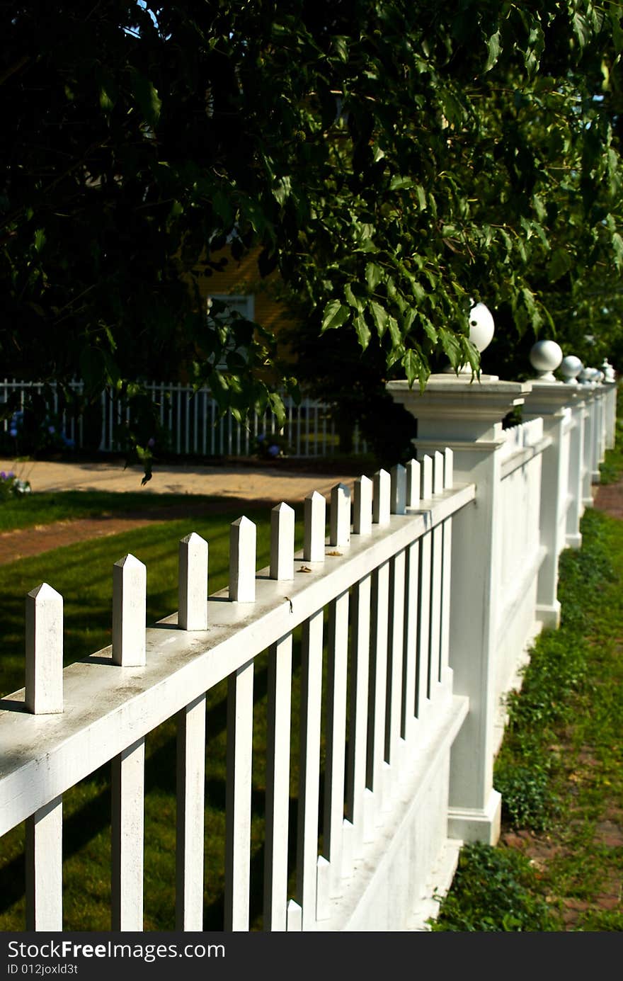 Classic new england picket fence stretching off into the distance. Classic new england picket fence stretching off into the distance