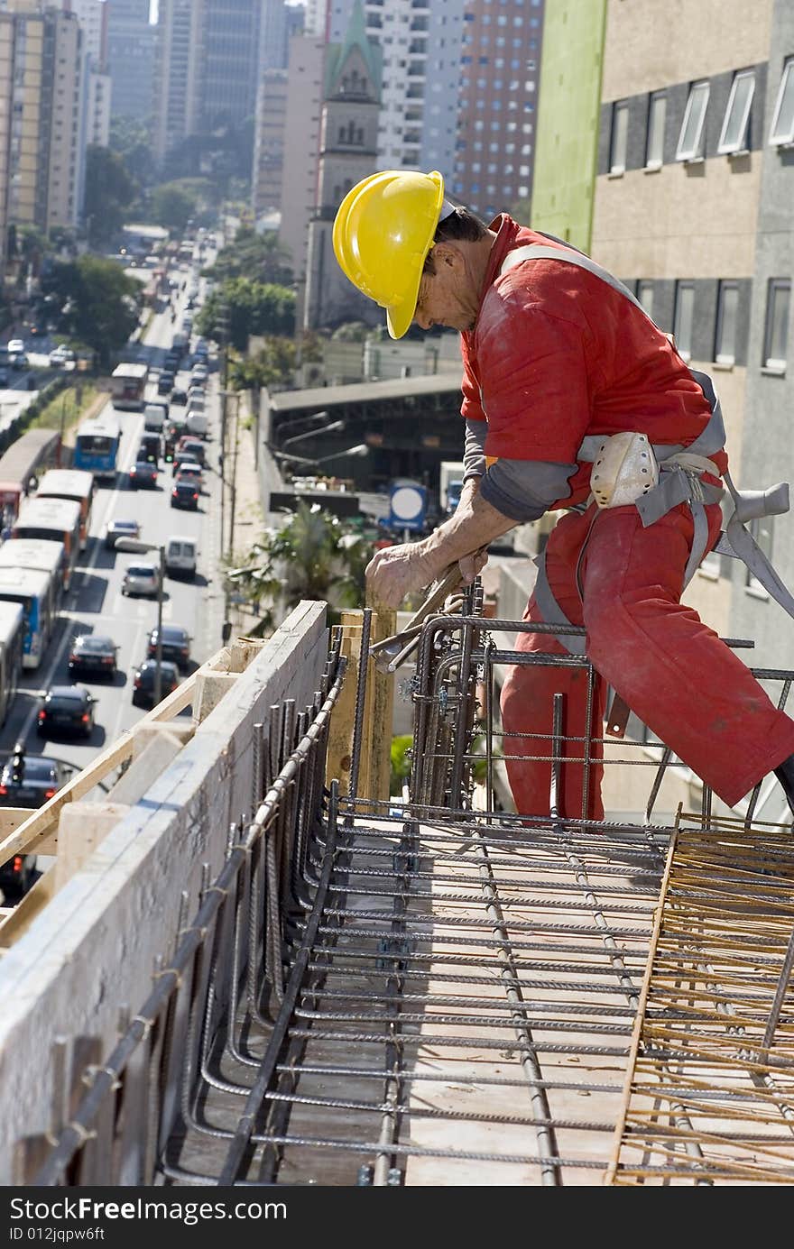 Worker Installs Rebar - Vertical