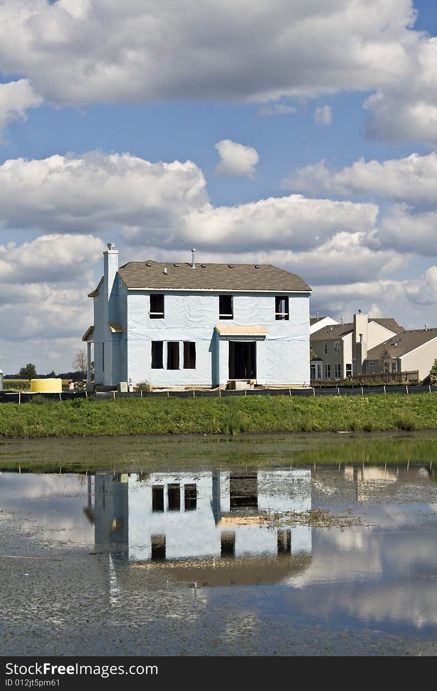 New construction reflected in the pond