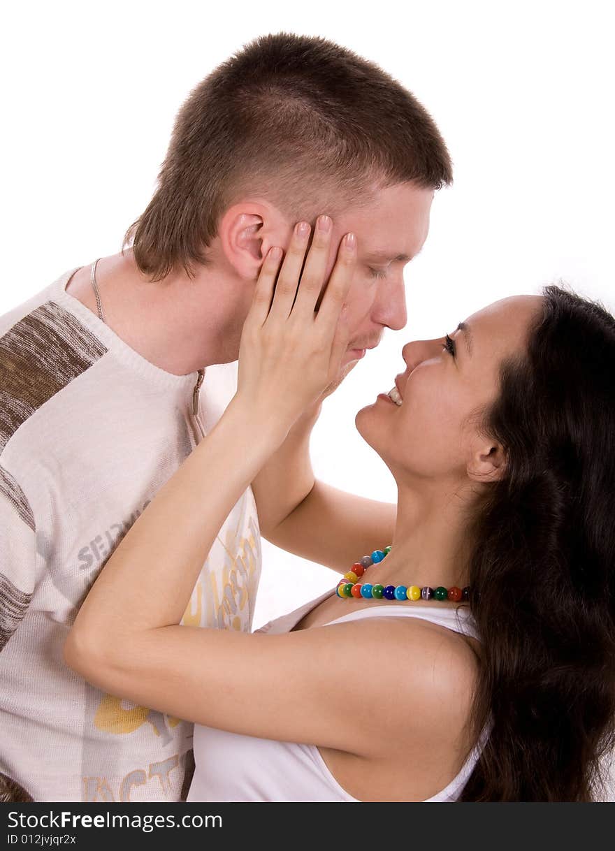 Loving young couple against white background. Loving young couple against white background