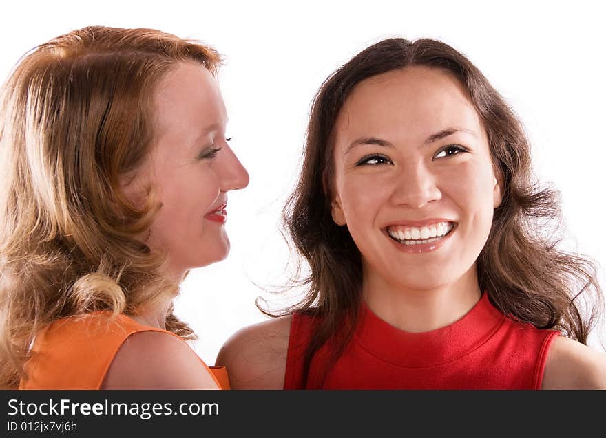 Two young gossiping girls against white background