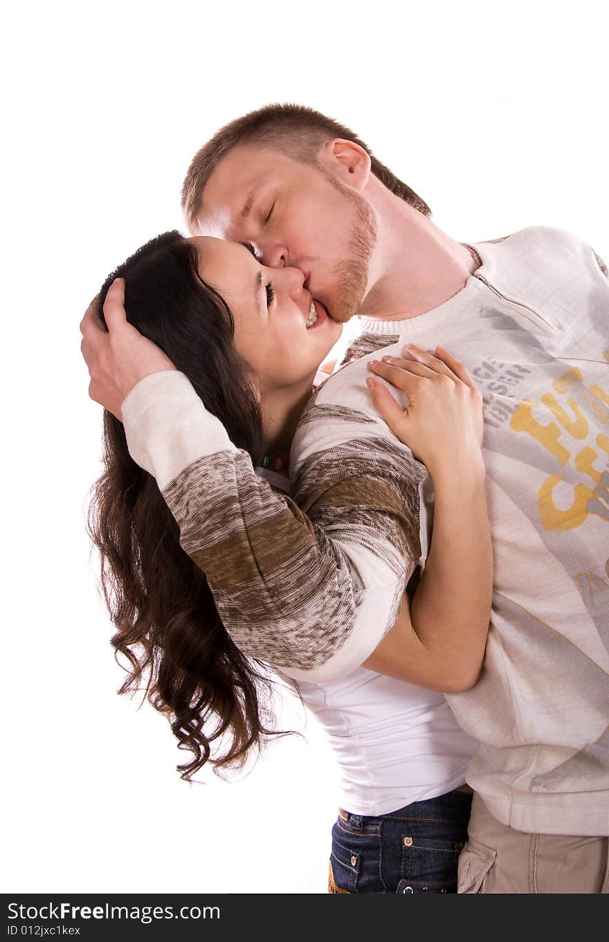 Loving young couple against white background. Loving young couple against white background