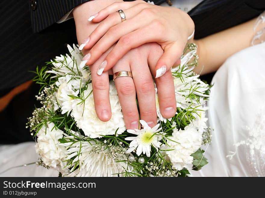 Hands touch of the newly married couple. Hands touch of the newly married couple