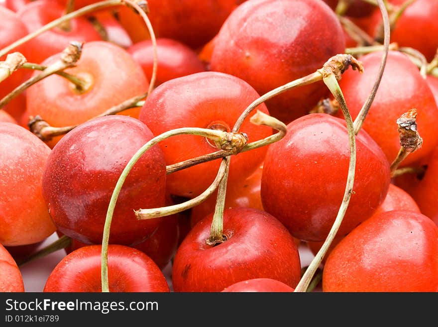 Fresh appetizing sweet cherry on a white background. Fresh appetizing sweet cherry on a white background