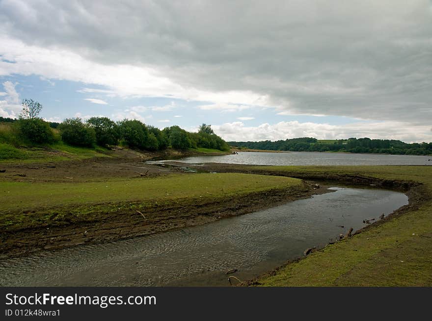 The waters streams out of the reservoir at tittesworth near leek in the united kingdom. The waters streams out of the reservoir at tittesworth near leek in the united kingdom