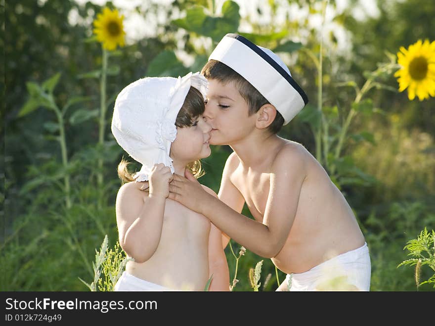 Brother sister embraces  on the solar glade. Brother sister embraces  on the solar glade