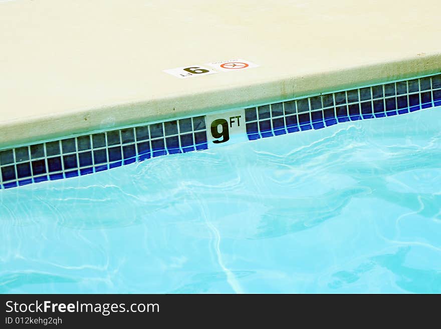 A Nine foot swimming pool water marker