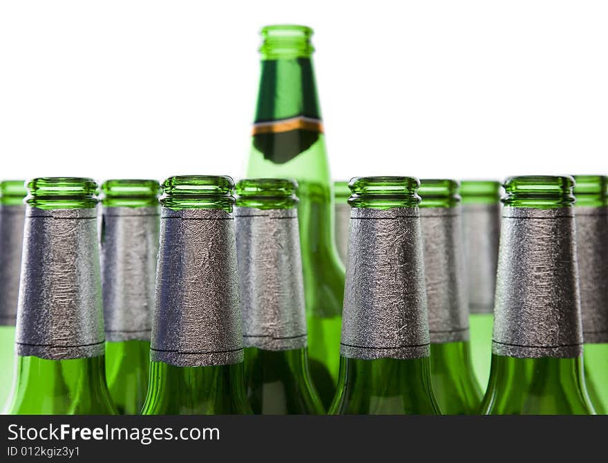 Concept of Glass Recycling or Alcohol Production - Green Glass Bottles Isolated on White. Concept of Glass Recycling or Alcohol Production - Green Glass Bottles Isolated on White