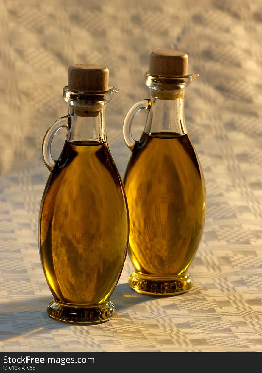 Olive oil in a small glasses bottles. Olive oil in a small glasses bottles