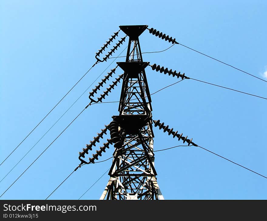 Power transmission line on a background of the blue sky