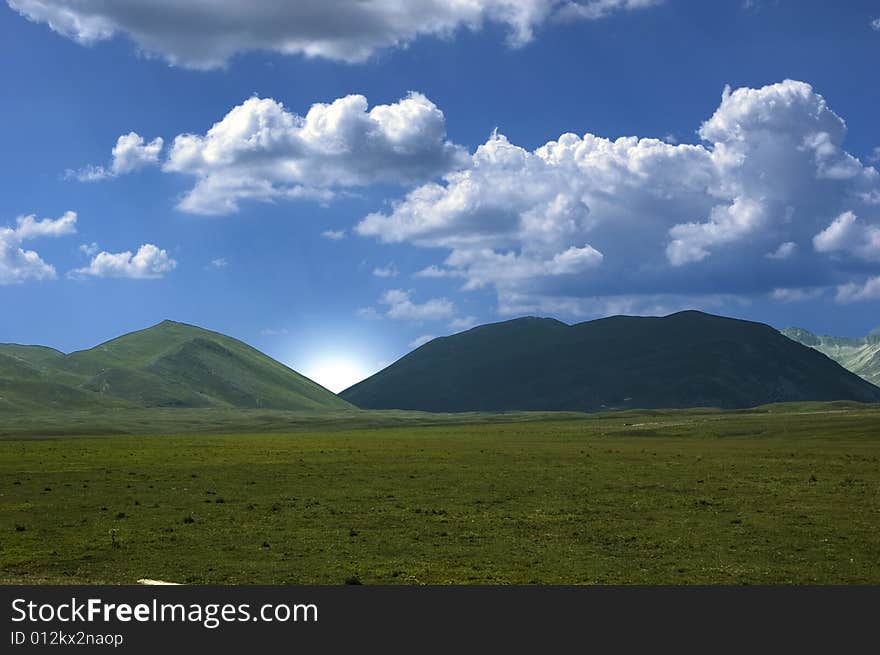 Magnificent view of a mountain with blue sky in the background.