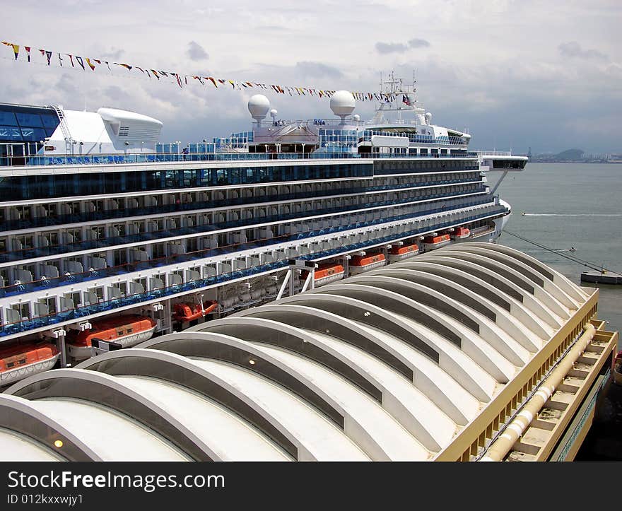 The roof of San Juan city port terminal and the cruise liner (Puerto Rico). The roof of San Juan city port terminal and the cruise liner (Puerto Rico).