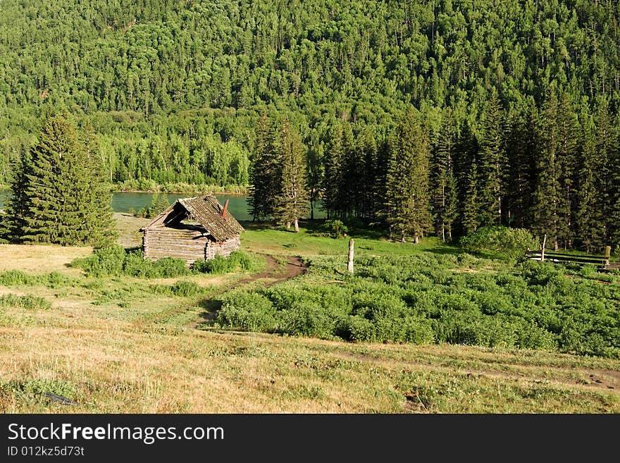 Wood house with cattle-pen in mountains. Wood house with cattle-pen in mountains