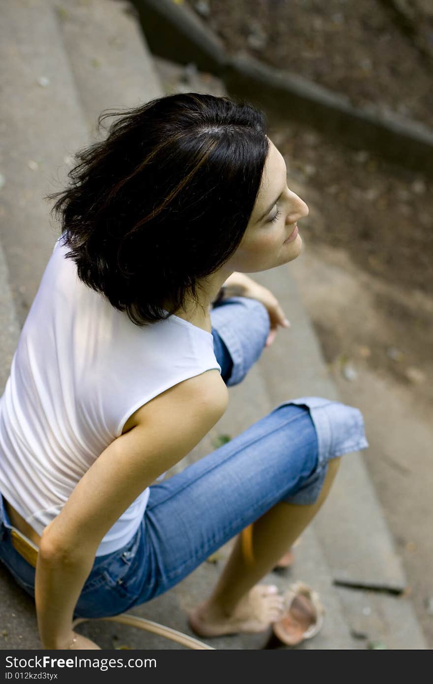 Woman sitting on a staircase