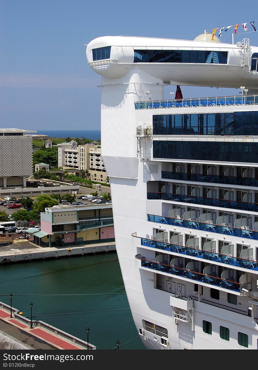 The cruise liner's back with San Juan downtown in a background (Puerto Rico).