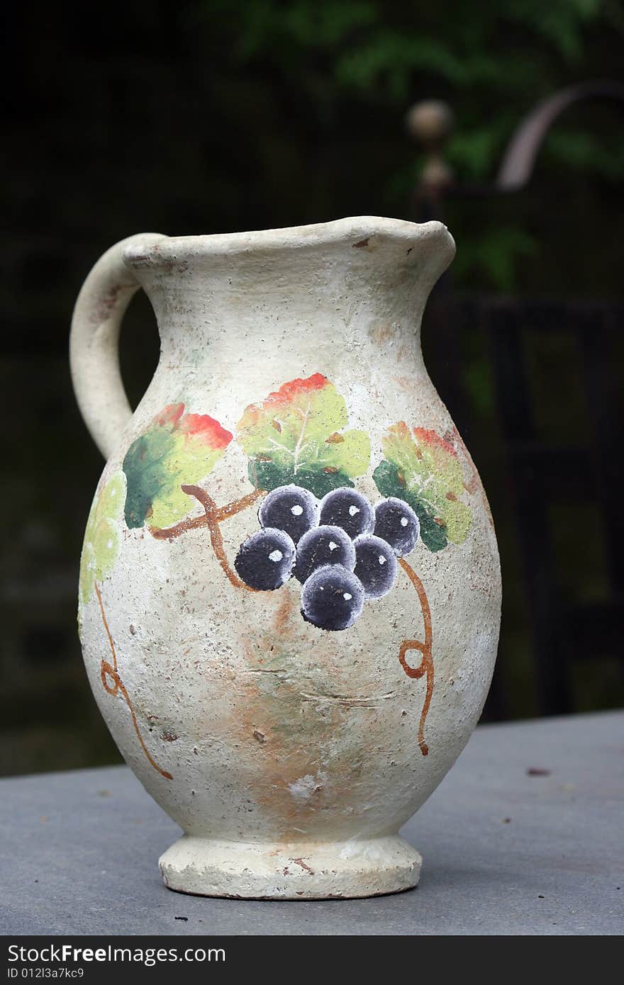 Old hand painted wine jug