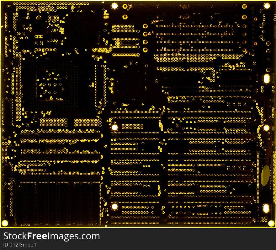 Yellow motherboard board lit from below through the board, creating a unique glow effect. Yellow motherboard board lit from below through the board, creating a unique glow effect.