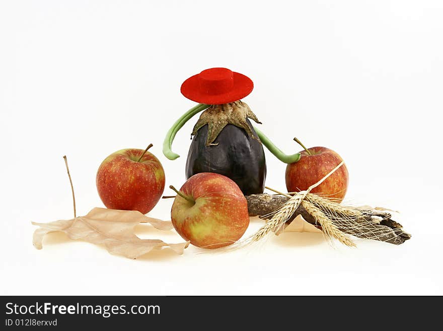 Composition from three red apples and an eggplant. Composition from three red apples and an eggplant