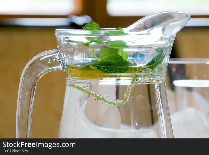 Mineral water with lemon and basil