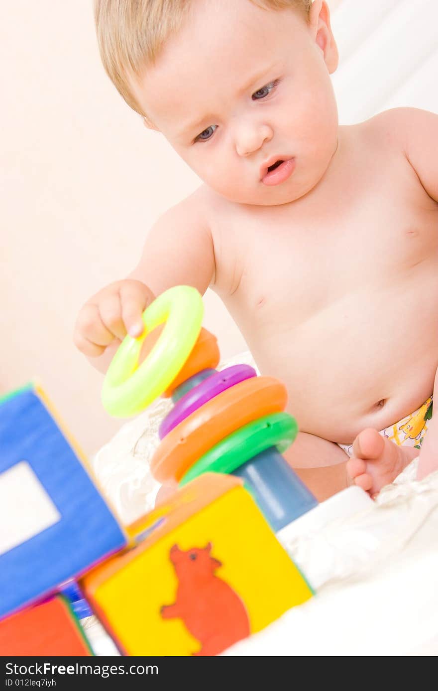 Cute little boy with soft cubes toy