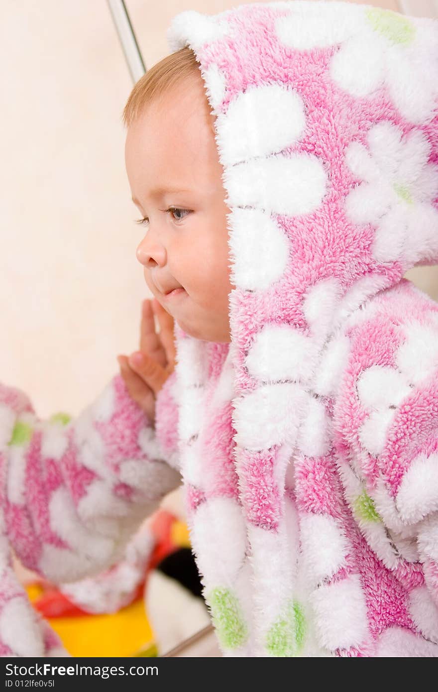 Cute Baby With Terry Bathrobe Looking At Mirror