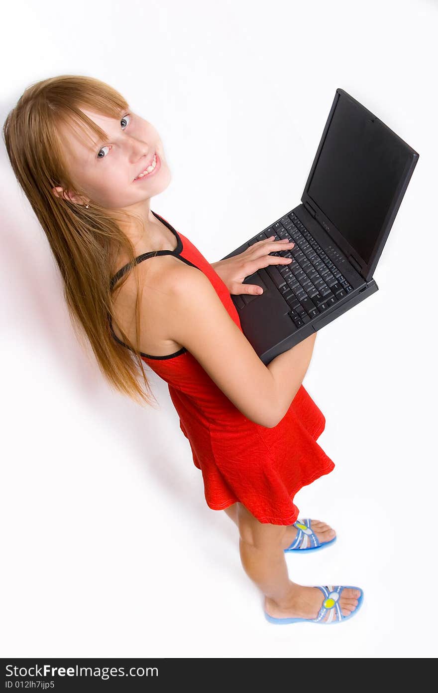 Pretty teenage girl with laptop, isolated over white