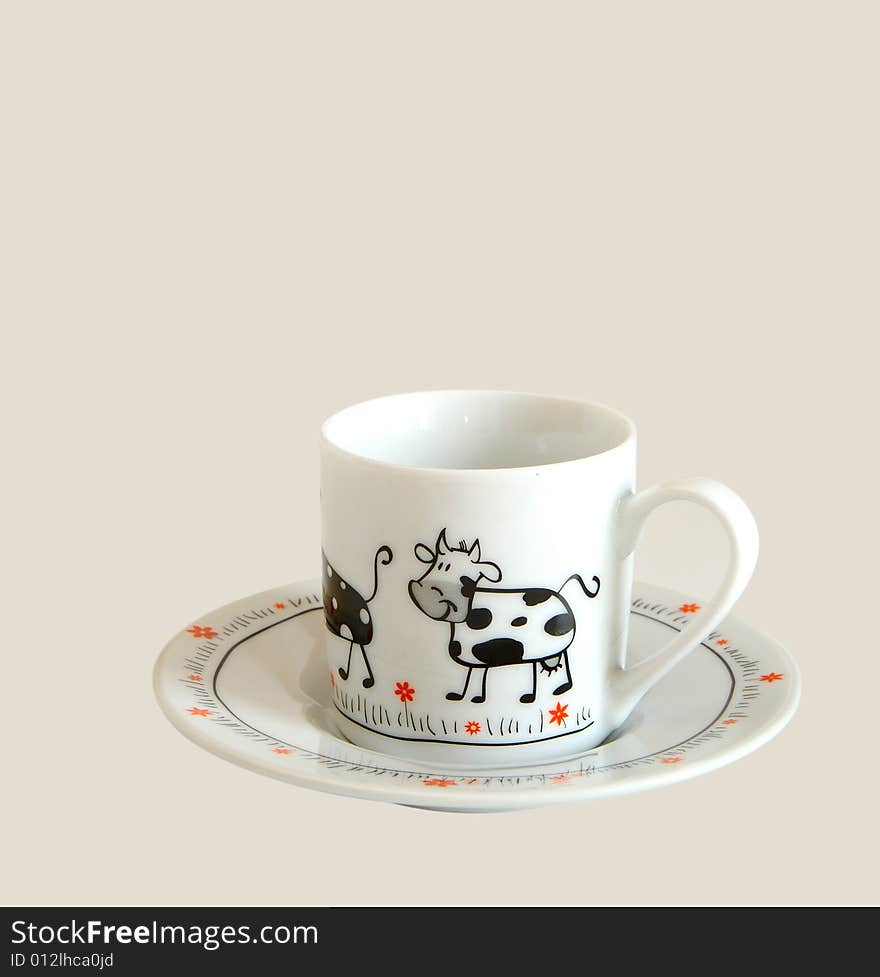 White cup for espresso with picture of cow on it