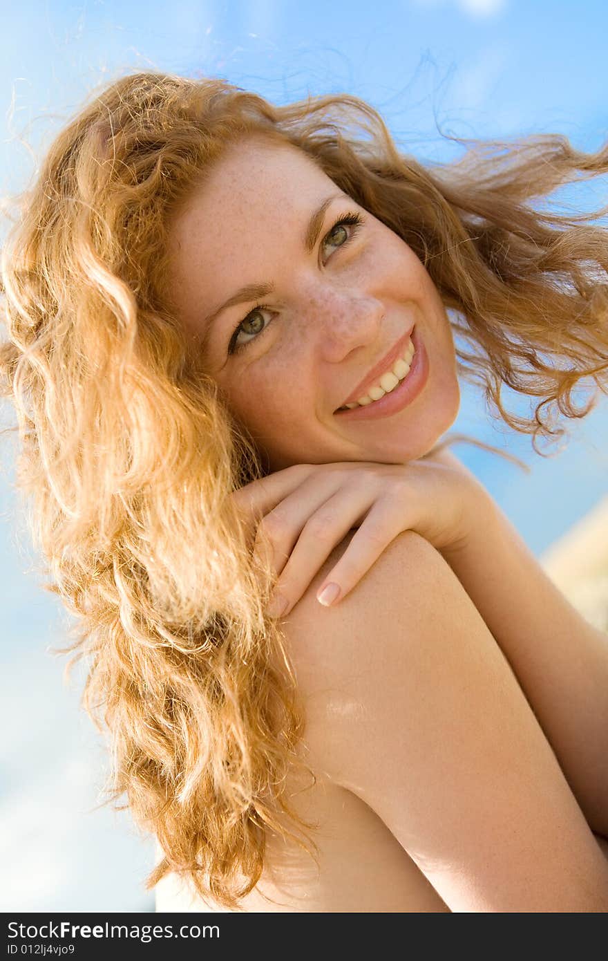 Red-haired girl outdoor portrait