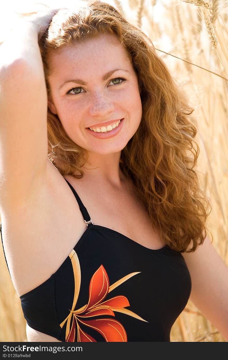 Beautiful red-haired girl outdoor portrait