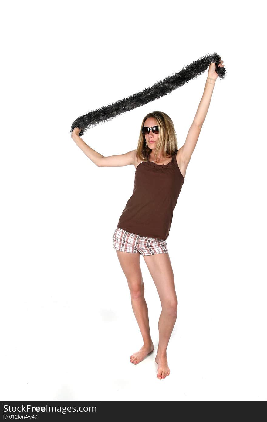 Teen in sunglasses lifting scarf over head. Teen in sunglasses lifting scarf over head