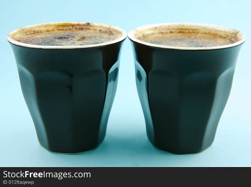 Cappuccino isolated against a blue background