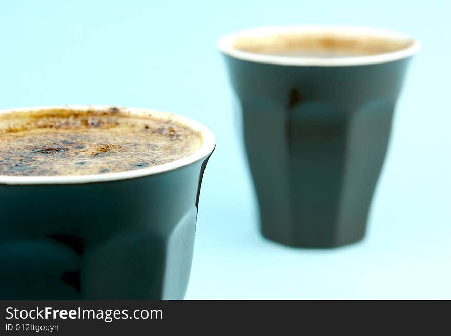 Cappuccino isolated against a blue background