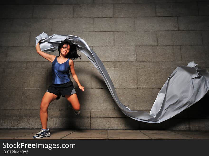 Pictures of people swirling fabric in motion. Useful for context on creativity or artistic expression or freeze motion. Pictures of people swirling fabric in motion. Useful for context on creativity or artistic expression or freeze motion.