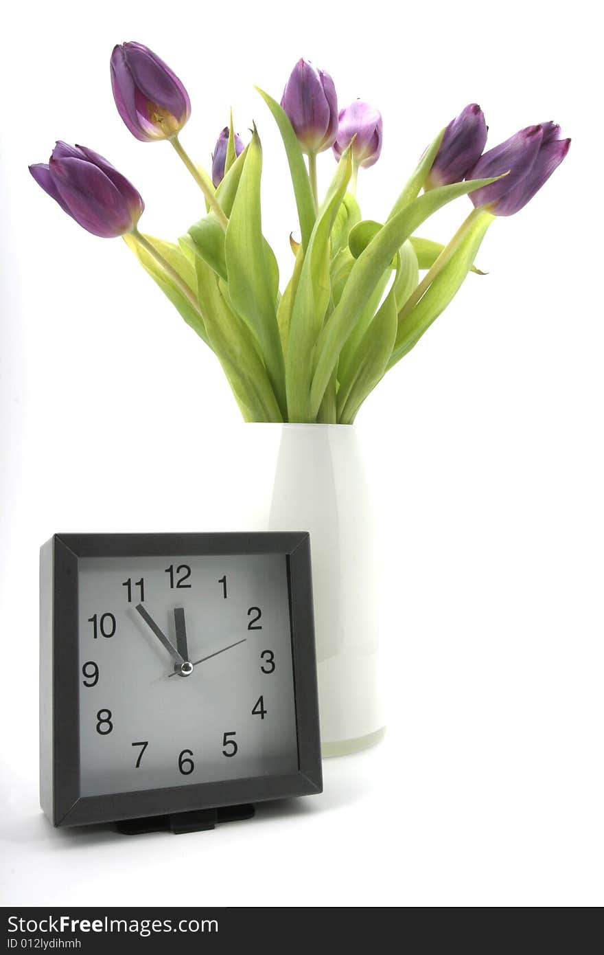 Clock with blooms of tulips