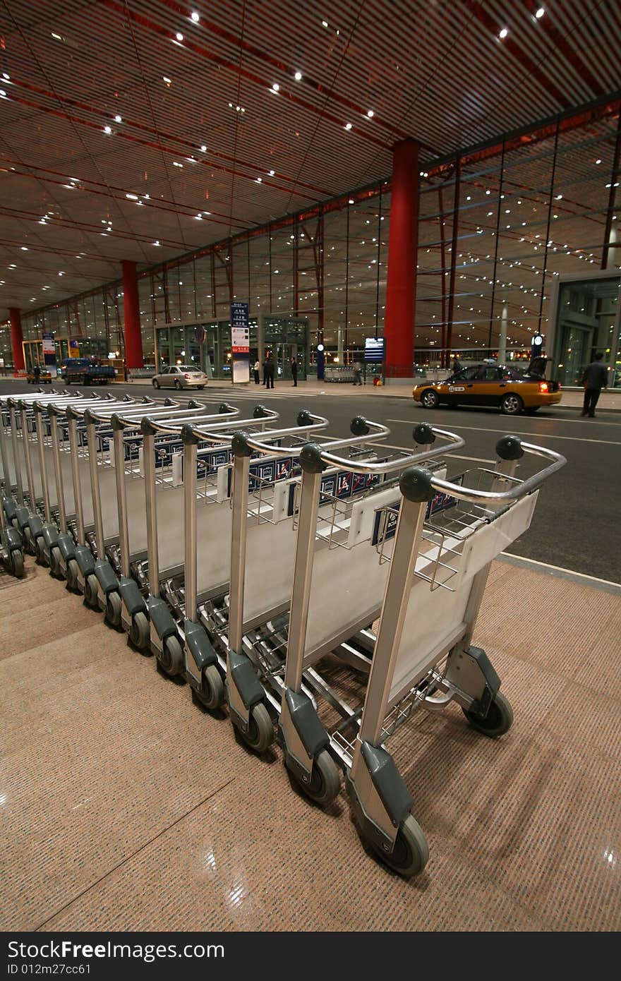 Set of empty baggage cars at airport terminal