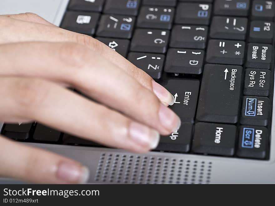 Woman typing on her laptop. Woman typing on her laptop