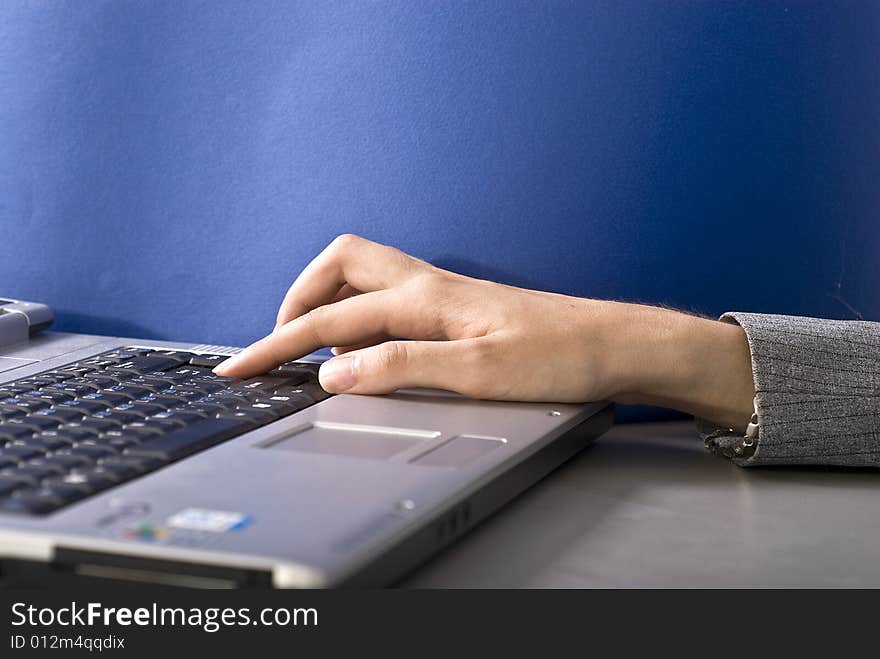 Woman typing on her laptop. Woman typing on her laptop