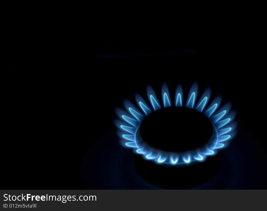 Flames of gas stove in the dark