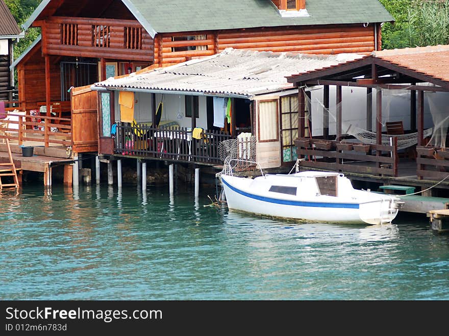 Small boat in front of house