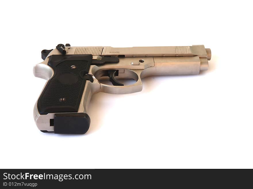 Nickel-plated gun on the white background. Nickel-plated gun on the white background