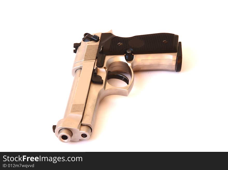 Nickel-plated gun on the white background