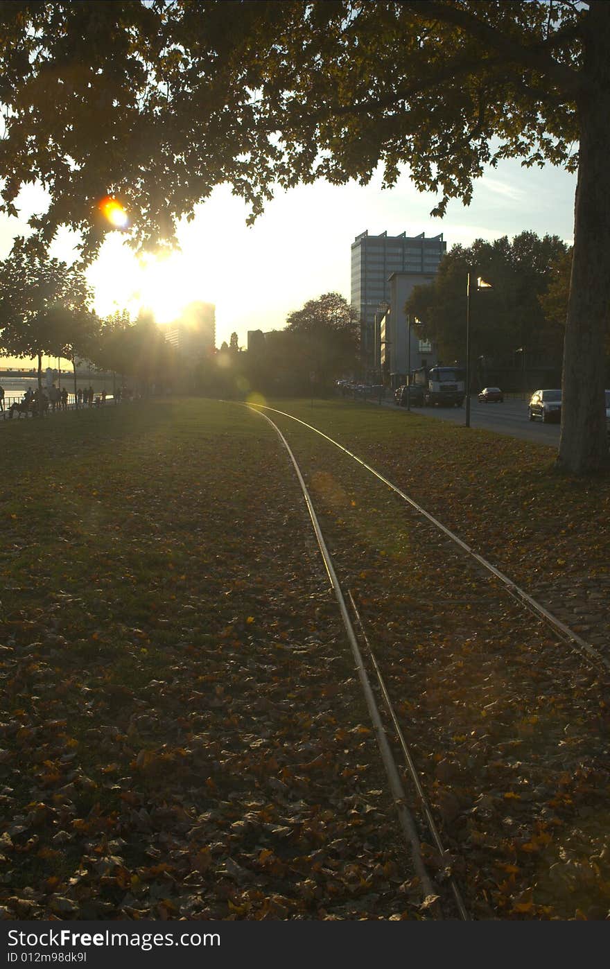 Rails of train that cross the park next to the River. Rails of train that cross the park next to the River.