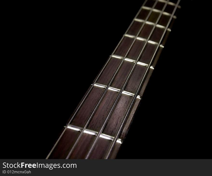 Guitar strings on plain black background