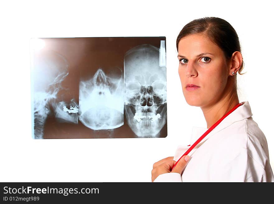 A beautiful young doctor with a red stethoscope and a xray image in the back. Isolated over white. A beautiful young doctor with a red stethoscope and a xray image in the back. Isolated over white.