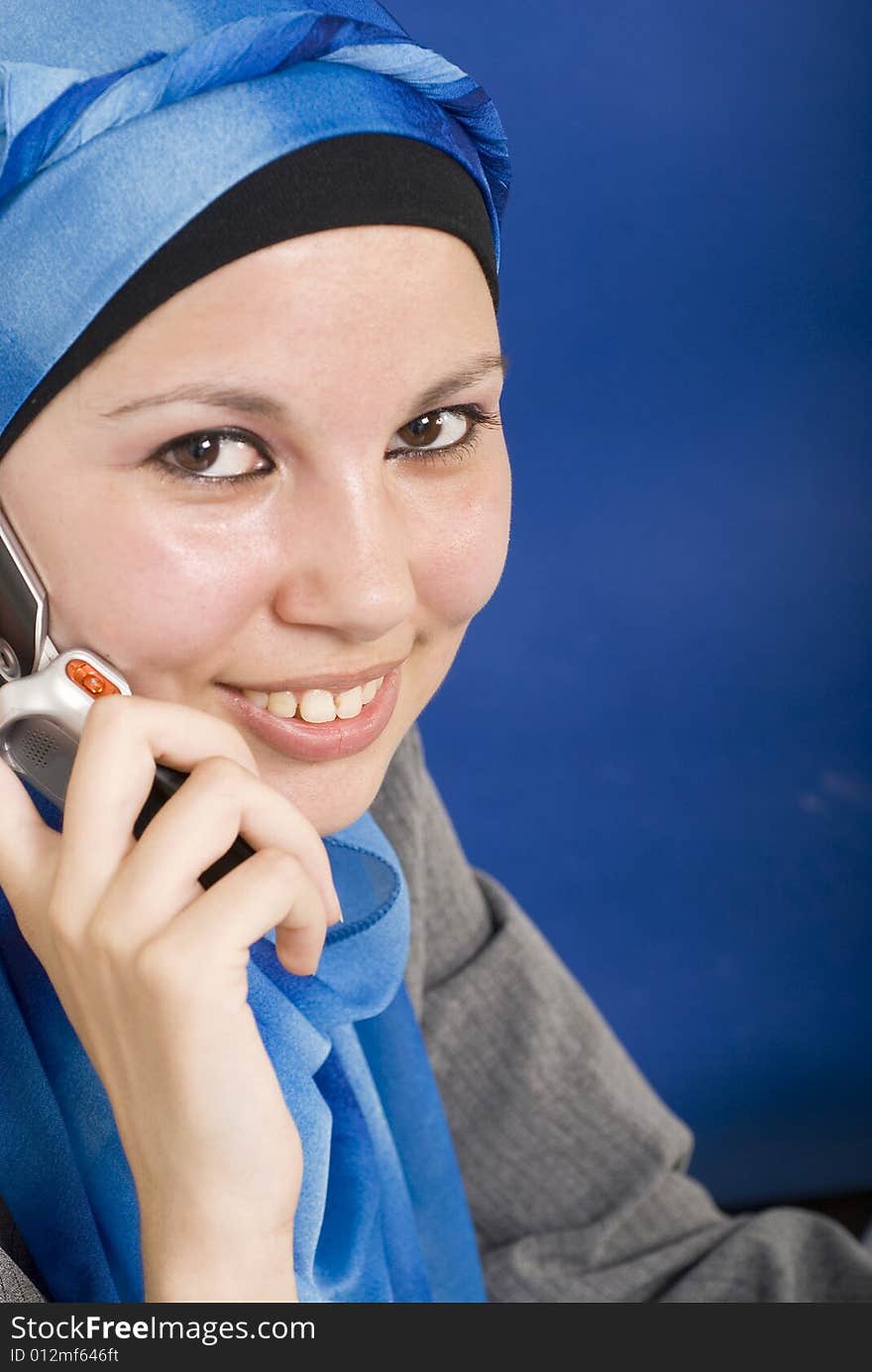 Covered woman talking on her cell. Covered woman talking on her cell