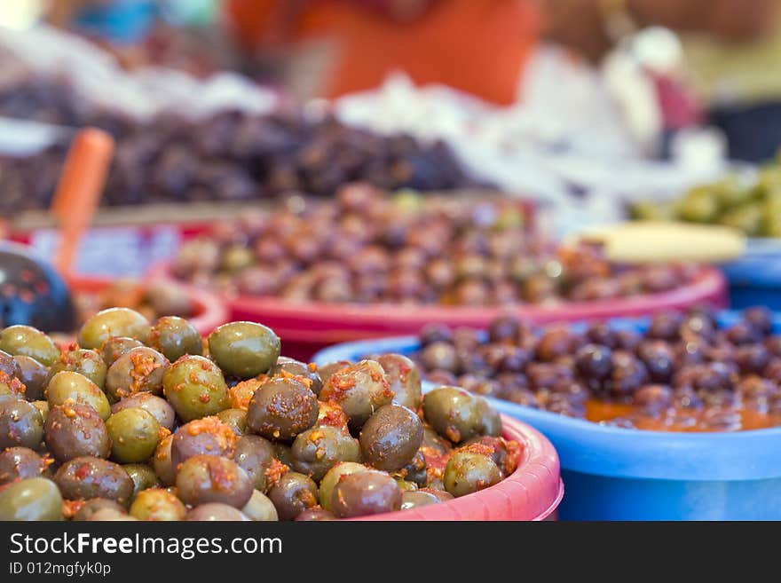 Spanish olives on red hot chili pepper sauce and green mojo. Spanish olives on red hot chili pepper sauce and green mojo